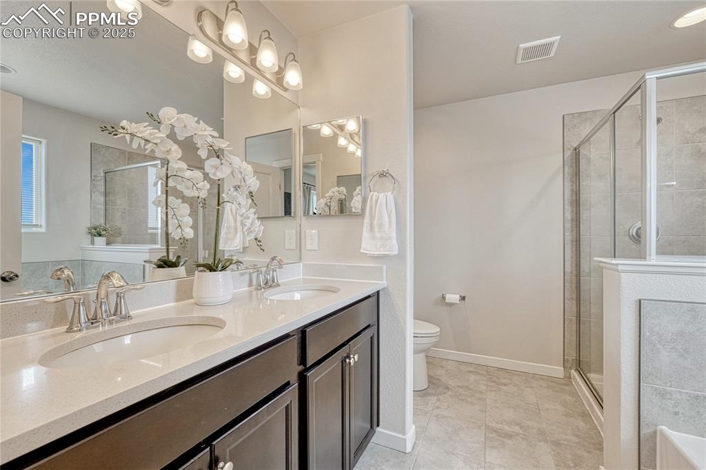 Image 10 of 50: Primary 5-piece bath with tile, double sink vanity w/quartz, standalone sho