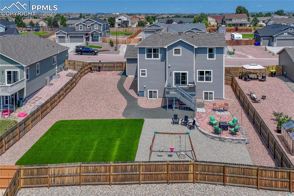 Image 11 of 50: Large, fenced, and fully landscaped lot!