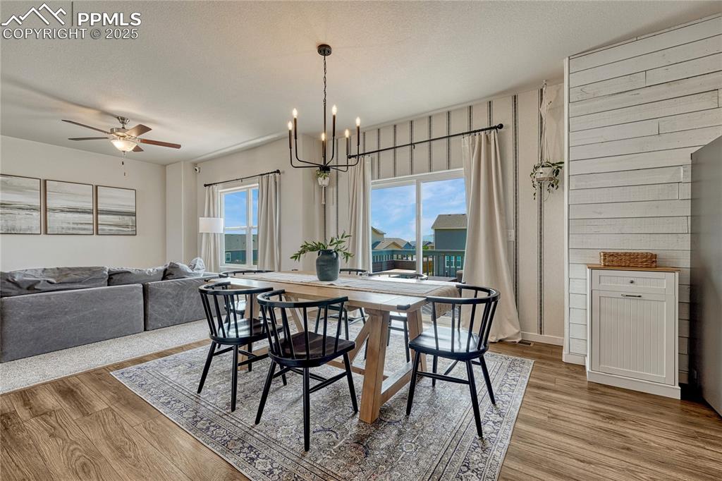Image 14 of 50: Dining area provides a walk-out to the back deck