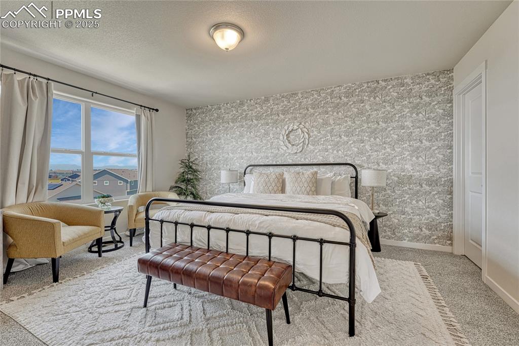Image 9 of 50: Accommodating Primary bedroom with walk-in closet and adjoining 5-piece bat