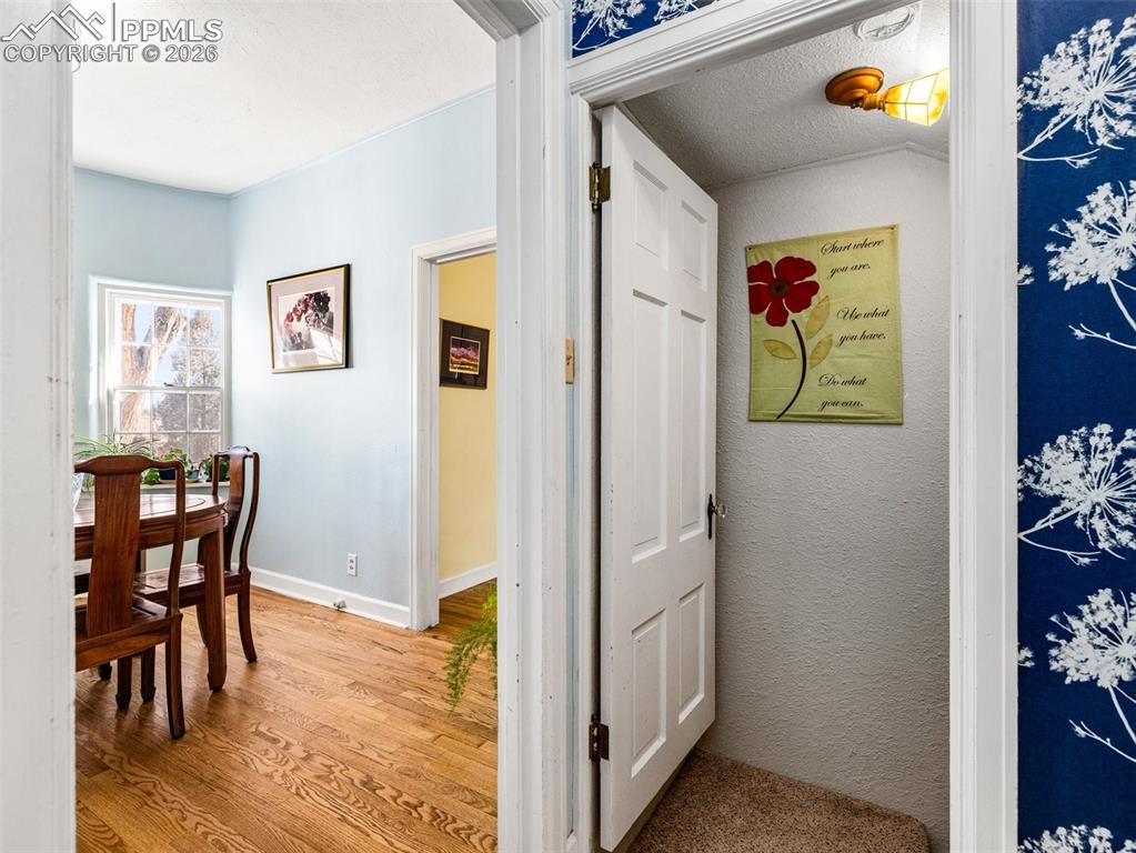 Image 11 of 50: Breakfast room and the stairs to lead to the finished basement.