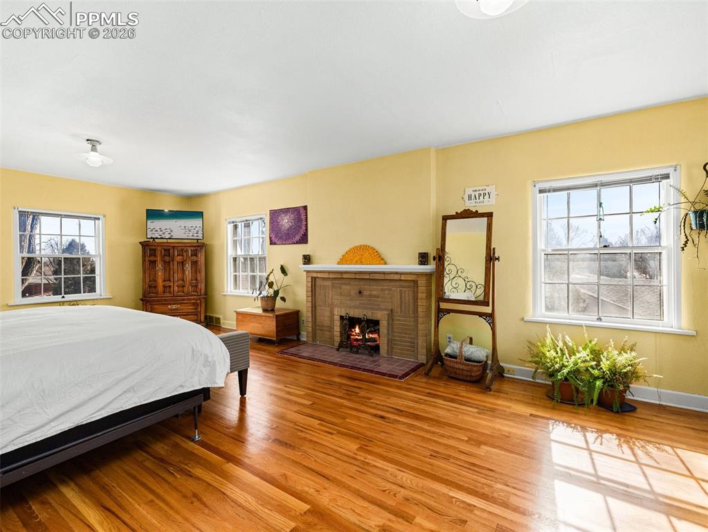 Image 27 of 50: The upper level bedroom is expansive in size. Not only offers great space,