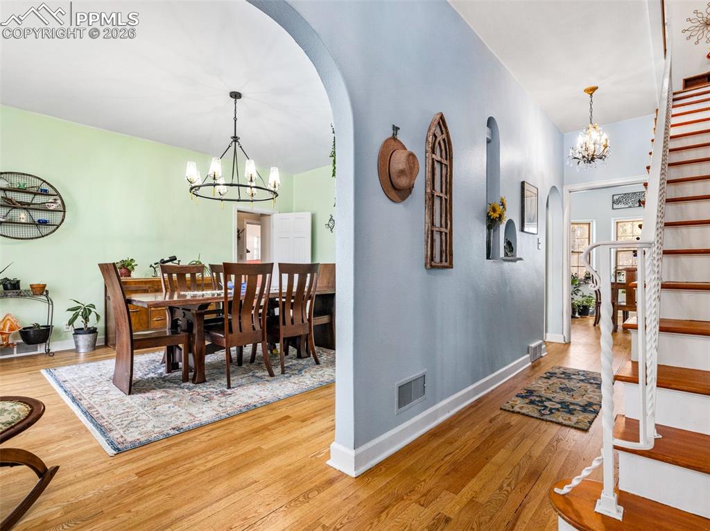 Image 3 of 50: The grand foyer leads to the dining room, living room or upstairs
