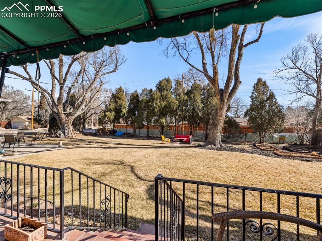 Image 45 of 50: This view is through the door in the living room. All landscaped, fully fen