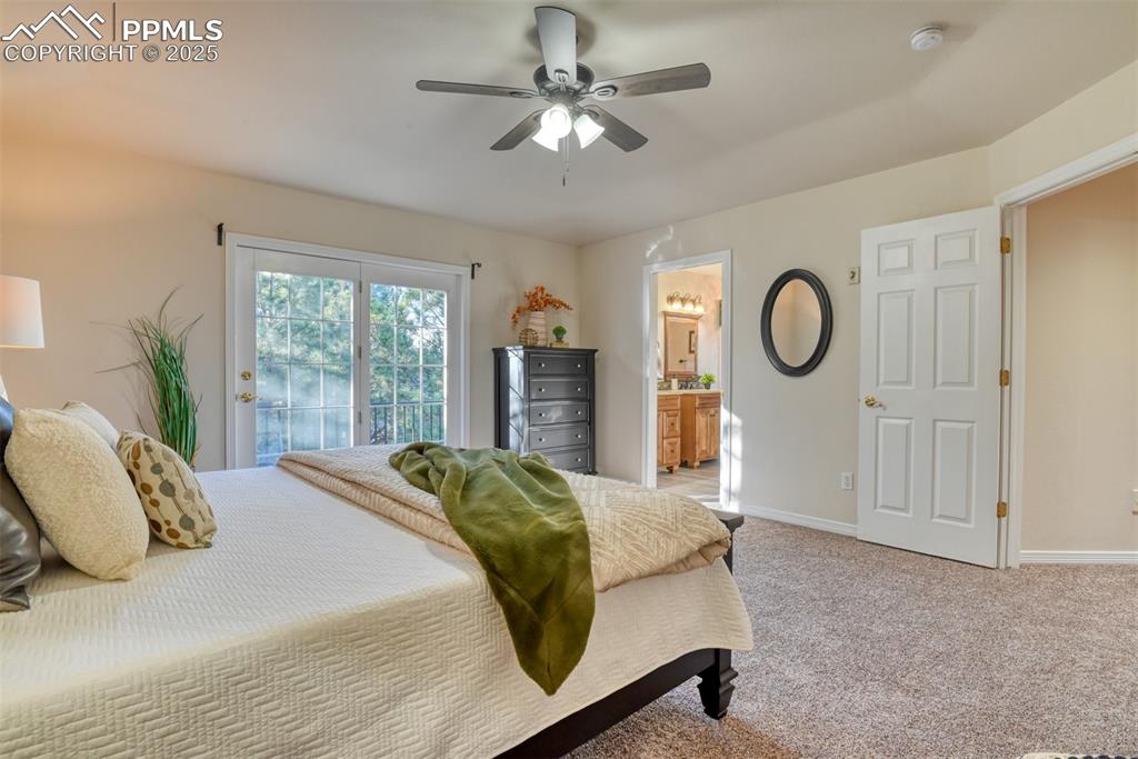 Image 27 of 44: Bedroom with light colored carpet, access to exterior, a ceiling fan, and c
