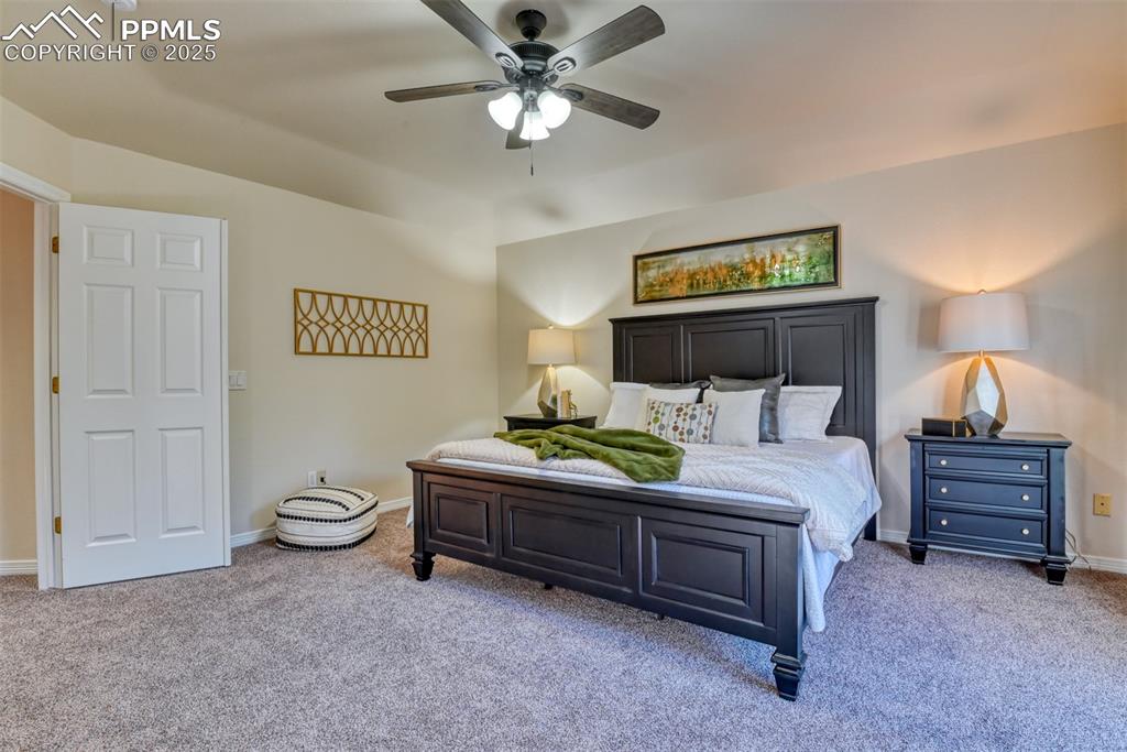 Image 28 of 44: Bedroom featuring light colored carpet and ceiling fan