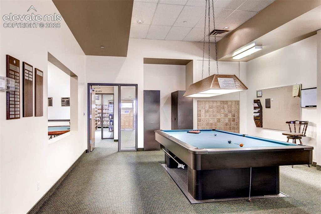 Image 21 of 27: Recreational room featuring a billiards table with an overhead light fixtur