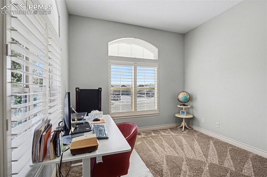 Image 16 of 32: Main level bedroom/office