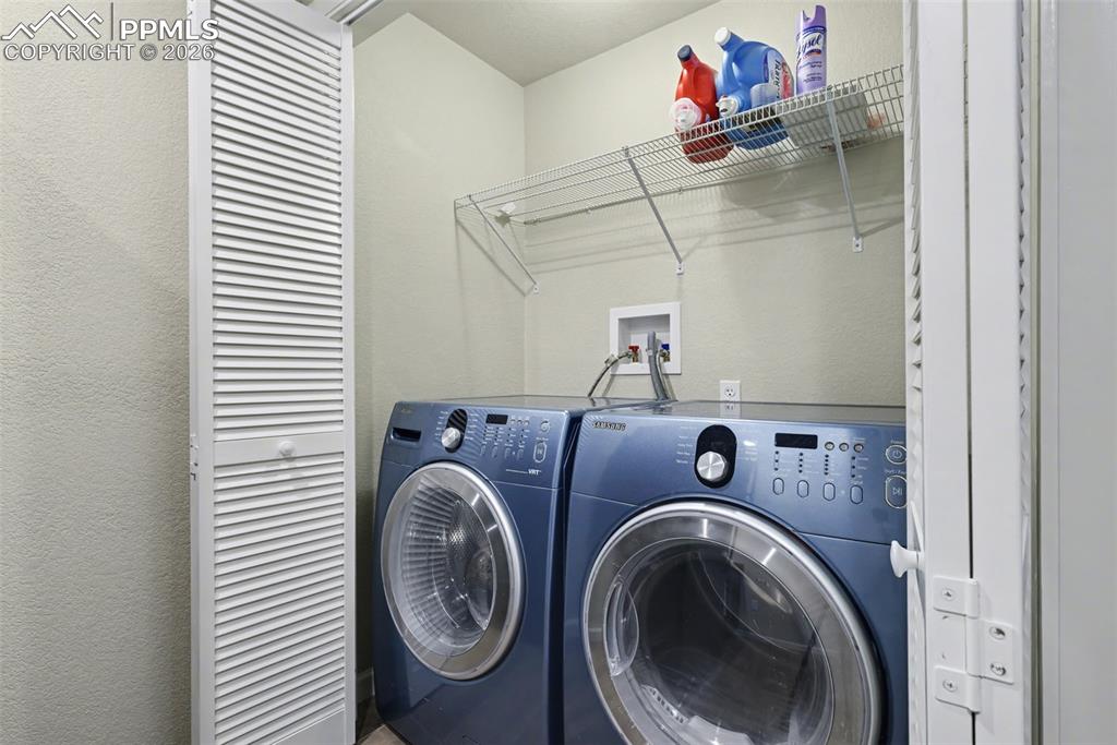 Image 34 of 50: laundry room in basement