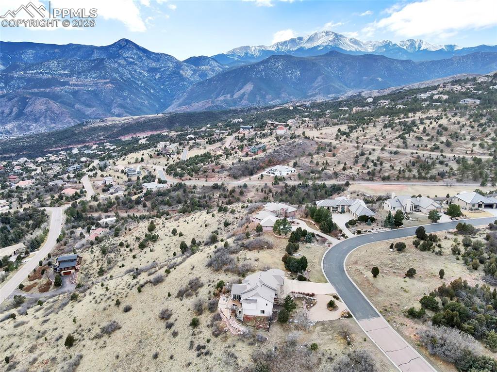 Image 11 of 16: Birds eye view of property with a mountain view