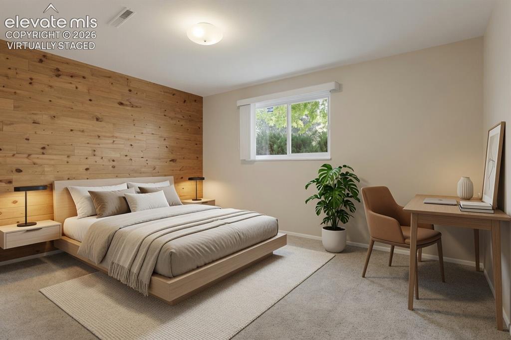 Image 13 of 31: Virtually Staged Bedroom Serene primary bedroom showcasing a wood-accent ac