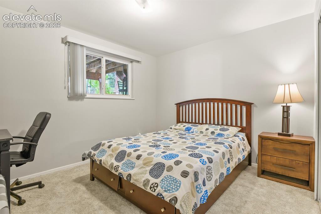 Image 23 of 31: Light gray walls with a window featuring horizontal blinds