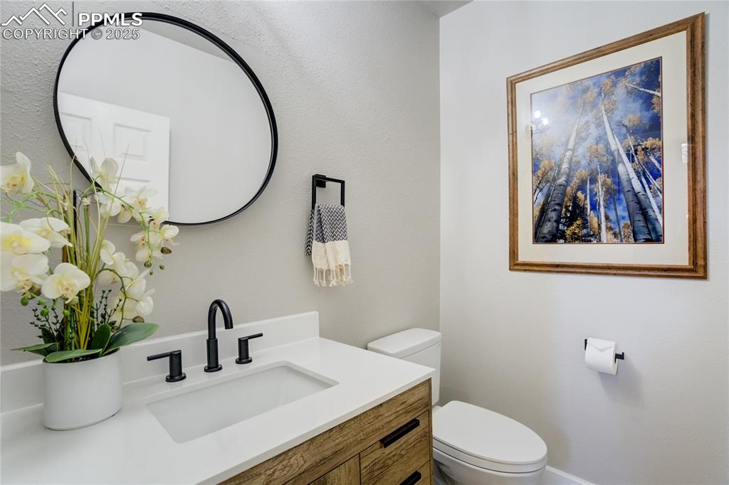 Image 17 of 50: Updated main level powder guest bath