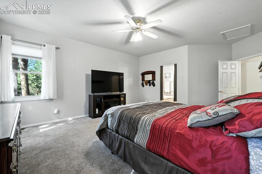 Image 20 of 45: Bedroom featuring carpet flooring, attic access, and a ceiling fan