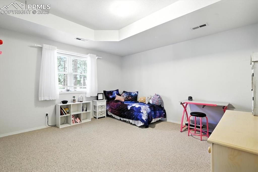 Image 31 of 45: Carpeted bedroom featuring baseboards