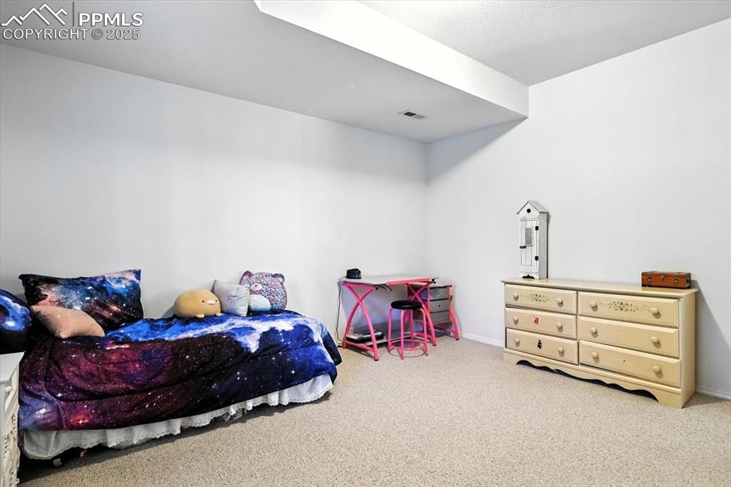 Image 32 of 45: Carpeted bedroom featuring baseboards
