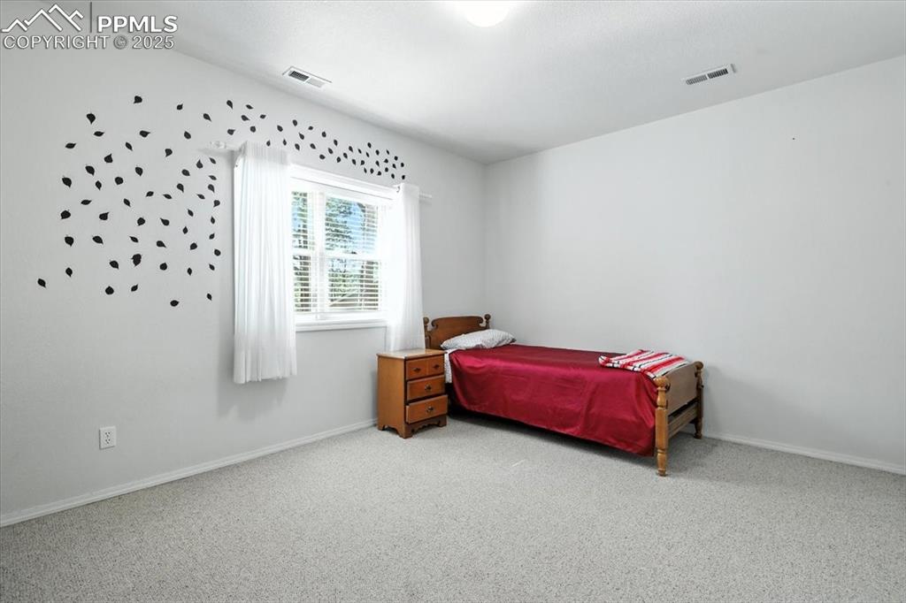 Image 33 of 45: Bedroom featuring carpet floors