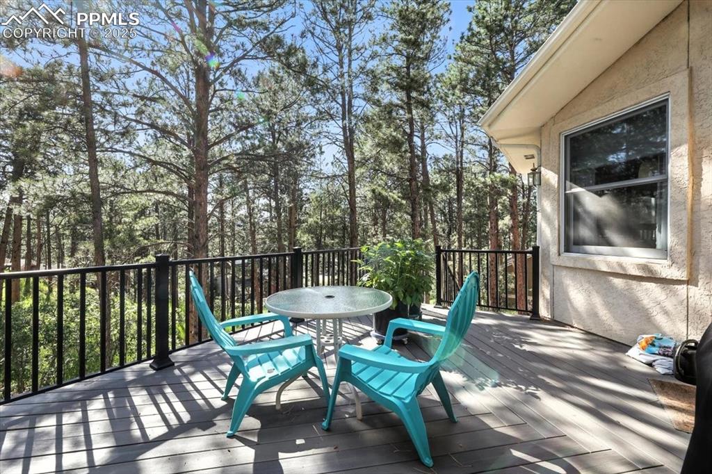 Image 41 of 45: Wooden terrace with outdoor dining space