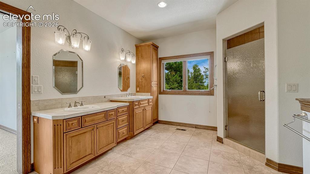 Image 12 of 50: Master Bathroom