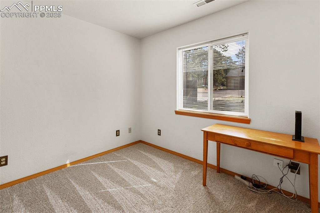 Image 15 of 30: Unfurnished office with light colored carpet and baseboards