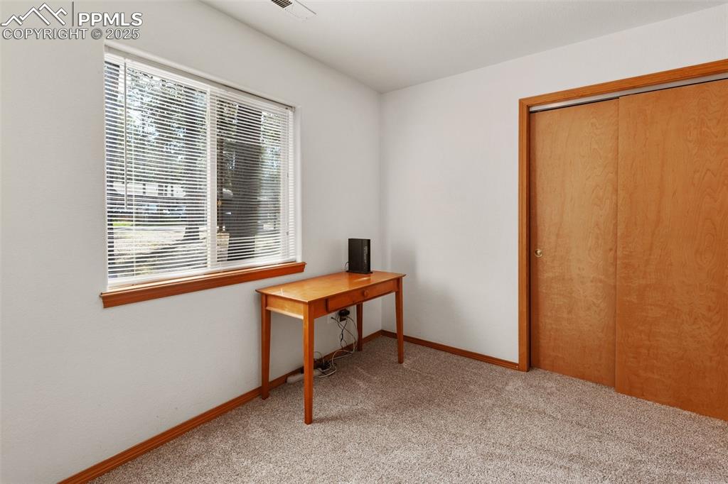 Image 16 of 30: Office space featuring light carpet and baseboards