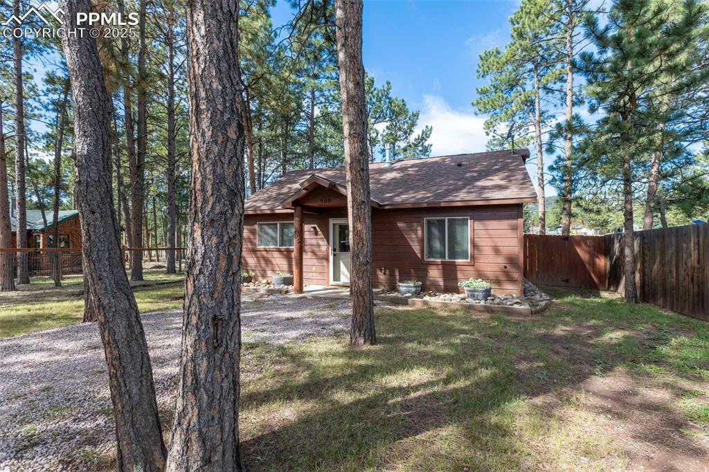 Image 27 of 30: View of front facade featuring roof with shingles