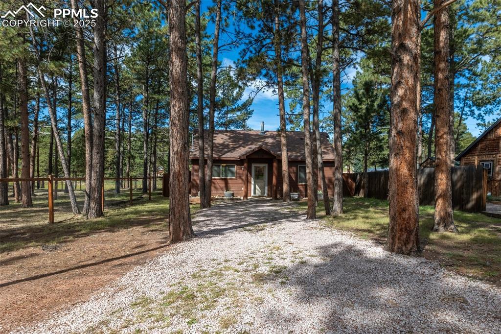 Image 28 of 30: Rustic home with driveway