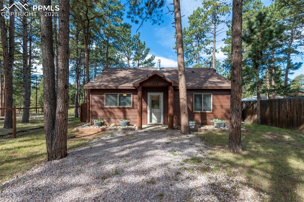 Image 29 of 30: View of front of house with roof with shingles