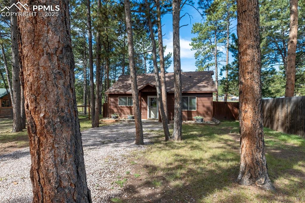 Image 3 of 30: View of front of home featuring a shingled roof