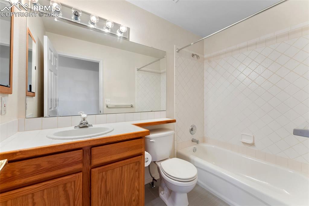 Image 19 of 34: Full bath featuring shower / bath combination and vanity