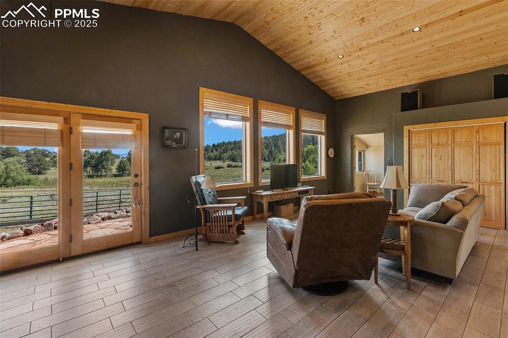 Image 13 of 50: 18" walls, earth tone walls, ceramic tile and views out every window.