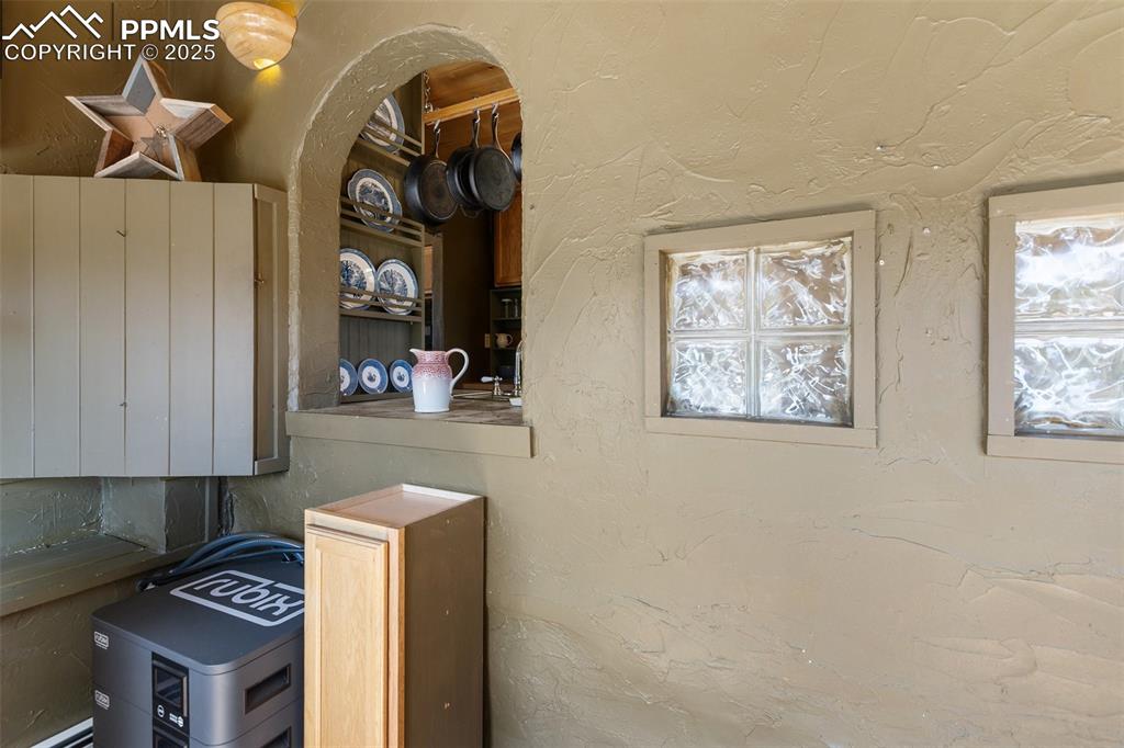 Image 26 of 50: Sunroom off the kitchen.