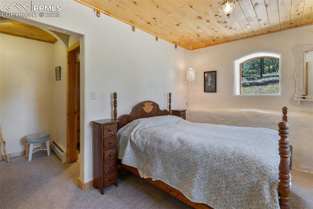 Image 32 of 50: Bedroom with attached bath.