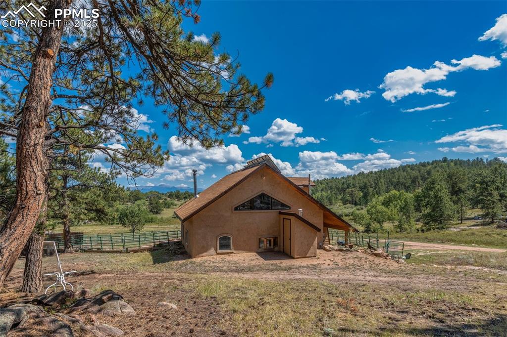 Image 4 of 50: West side of the home. Open pastures for your horses. National Forest land