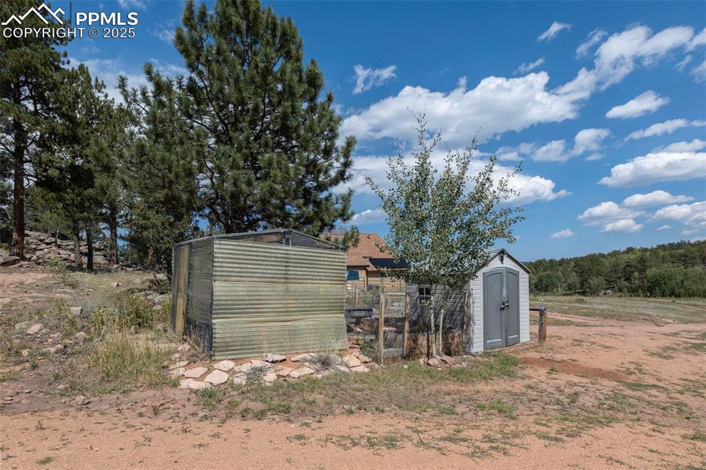 Image 45 of 50: Green house and Garden tool storage shed. Ready for your hobby farm enthusi