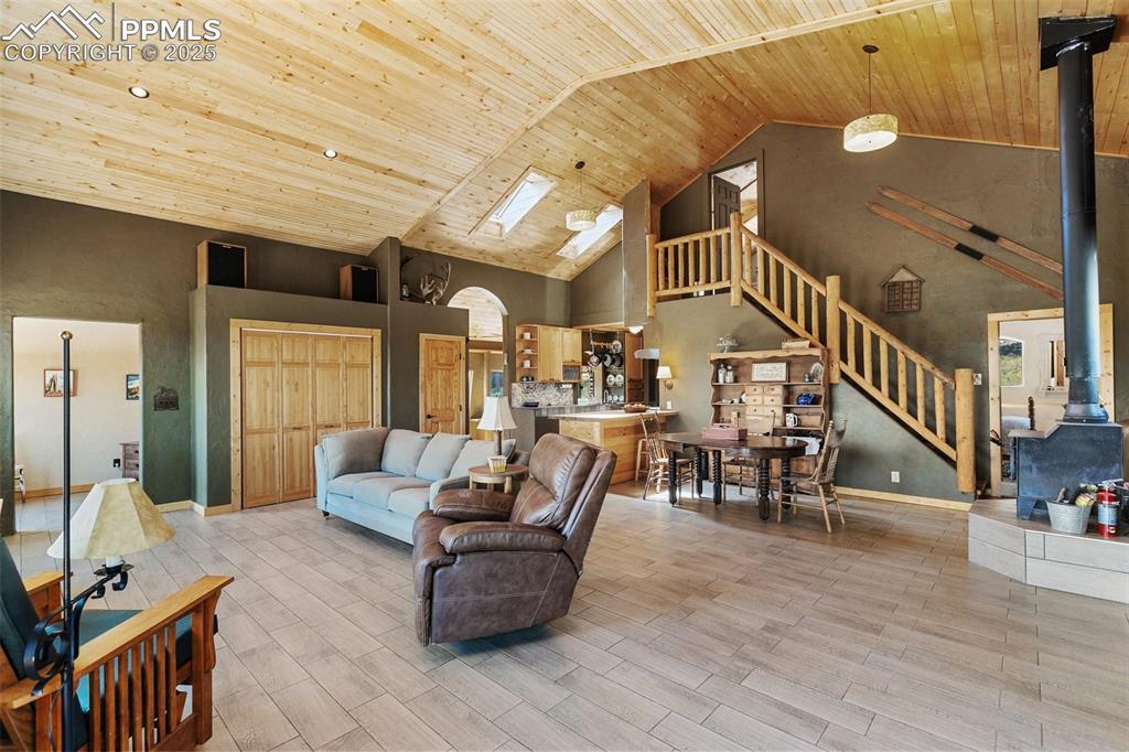 Image 8 of 34: Great room brings the living, dining, and kitchen space into an open and ai