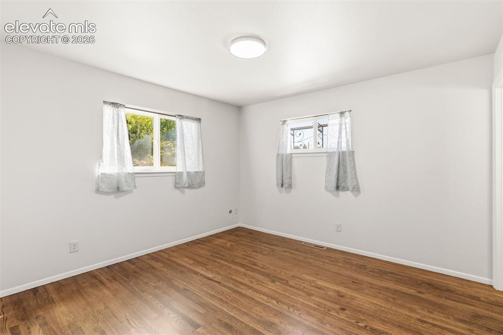 Image 21 of 38: Primary bedroom with ensuite bathroom.