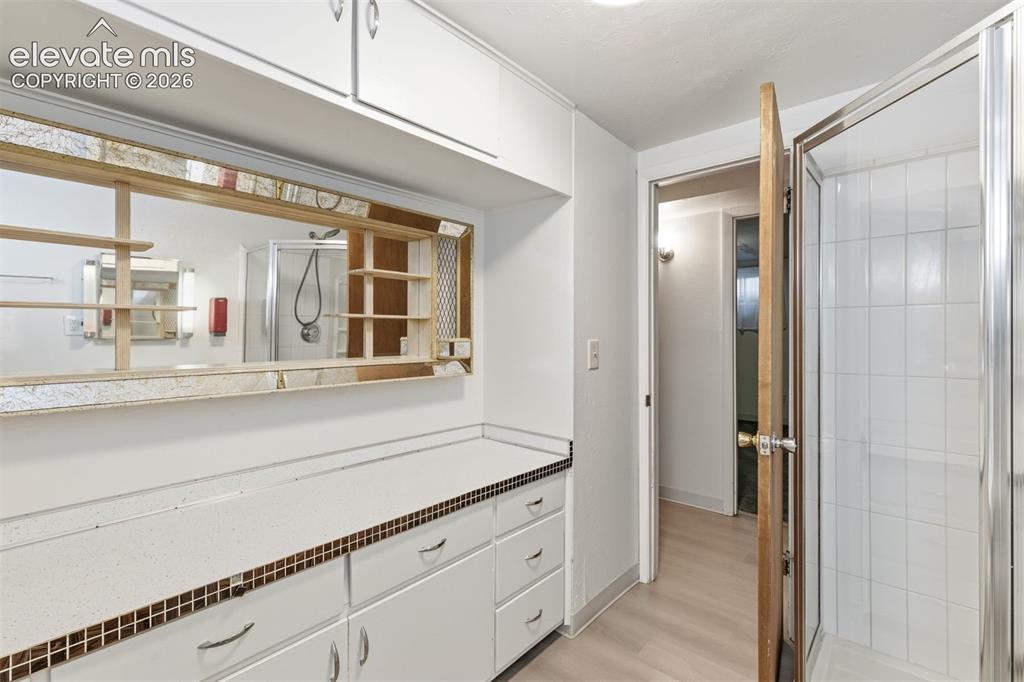 Image 31 of 38: Separate entrance to the basement with a kitchenette.
