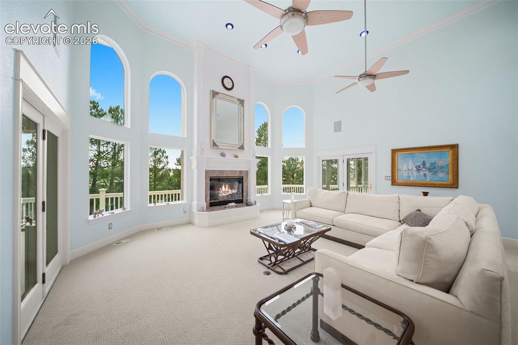 Image 7 of 50: Vaulted ceiling featuring recessed lighting and two ceiling fans