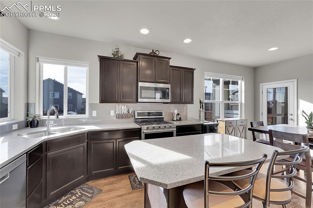 Image 11 of 42: Kitchen features quartz counters