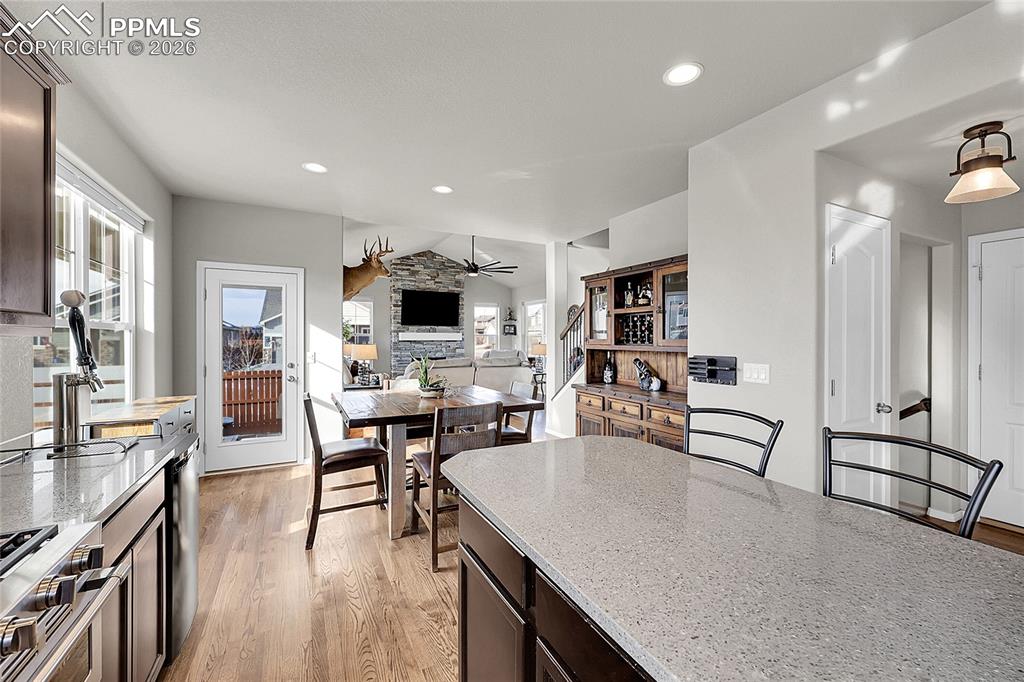 Image 12 of 42: Kitchen opens to back patio, dining area and living room