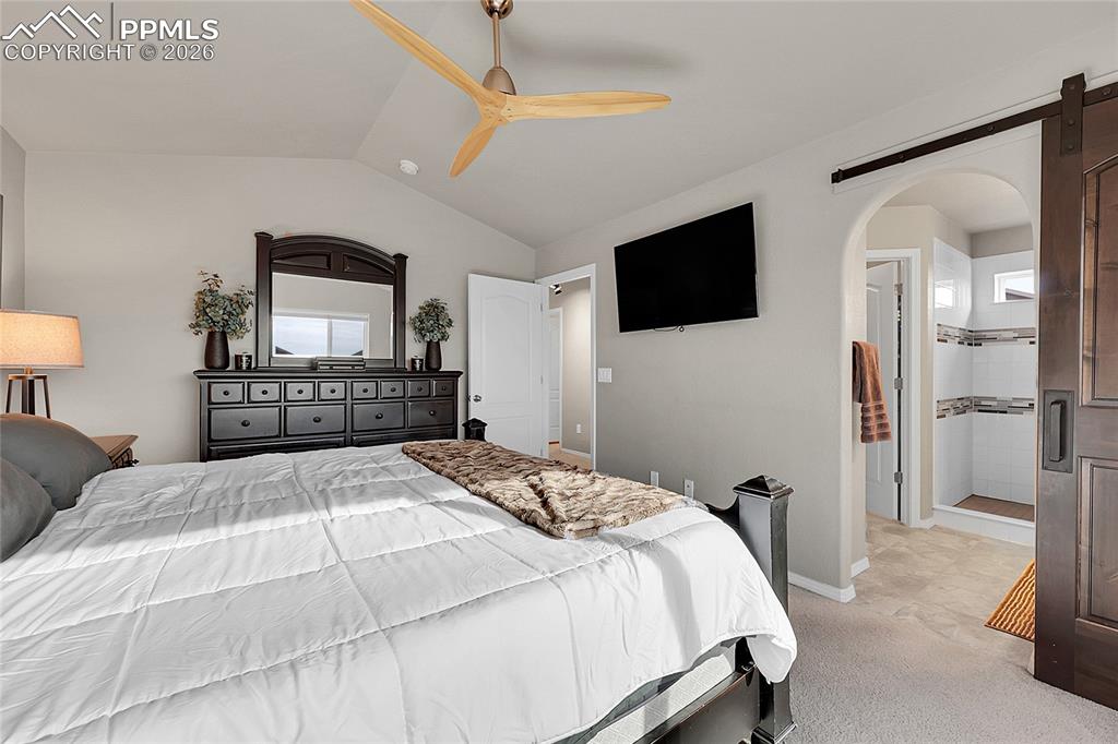 Image 16 of 42: Alternate view of primary bedroom with en-suite