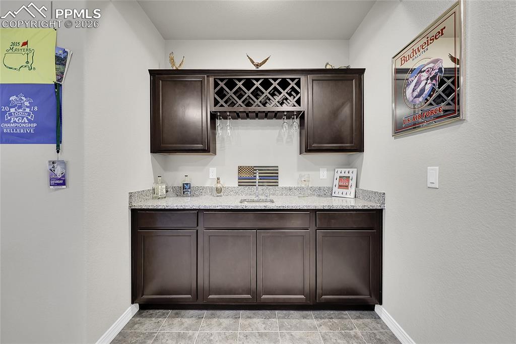 Image 28 of 42: Basement includes a great functional wet bar
