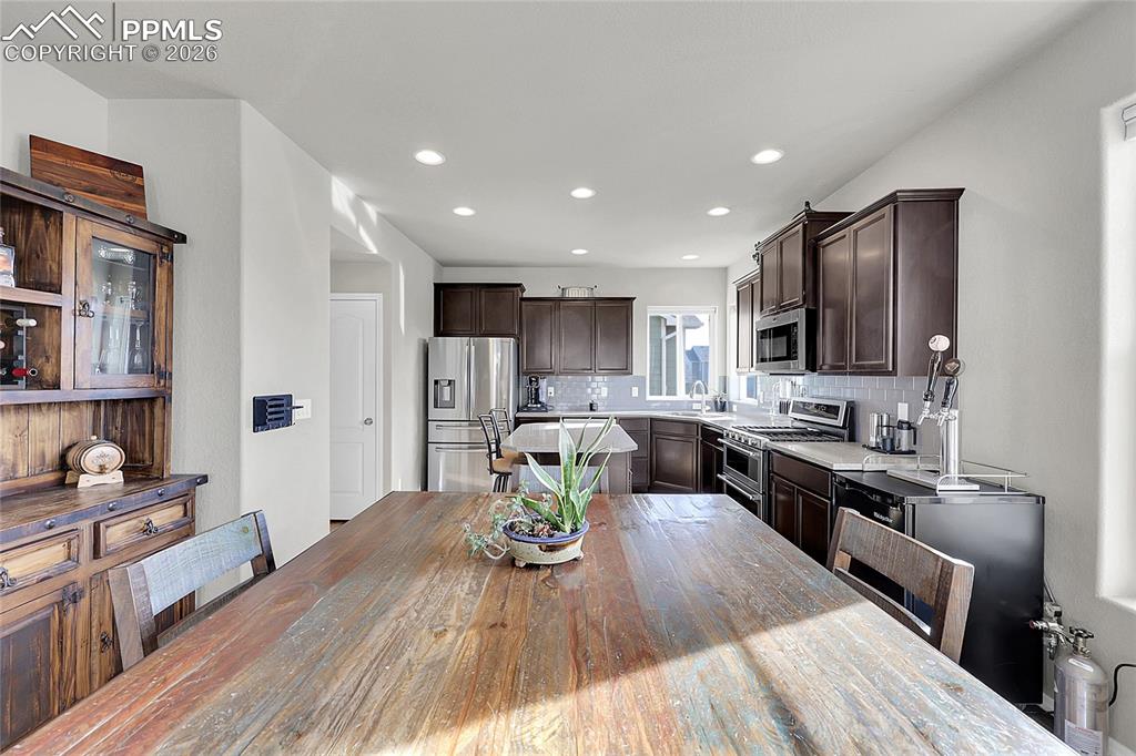 Image 9 of 42: Open eat in kitchen with gas range