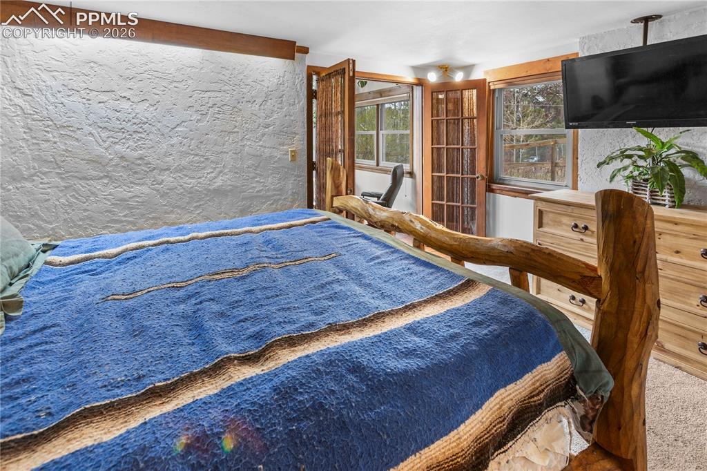 Image 13 of 38: Lower Level Master Bedroom