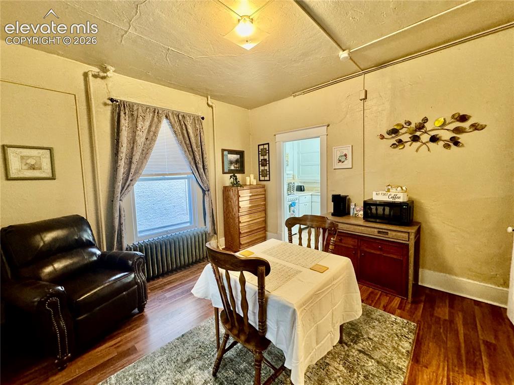 Image 4 of 50: Wood-finish flooring throughout