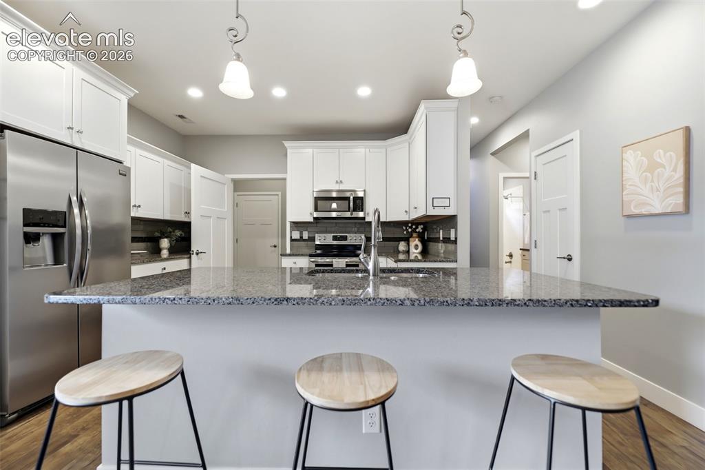 Image 11 of 42: Kitchen Island and Breakfast Bar