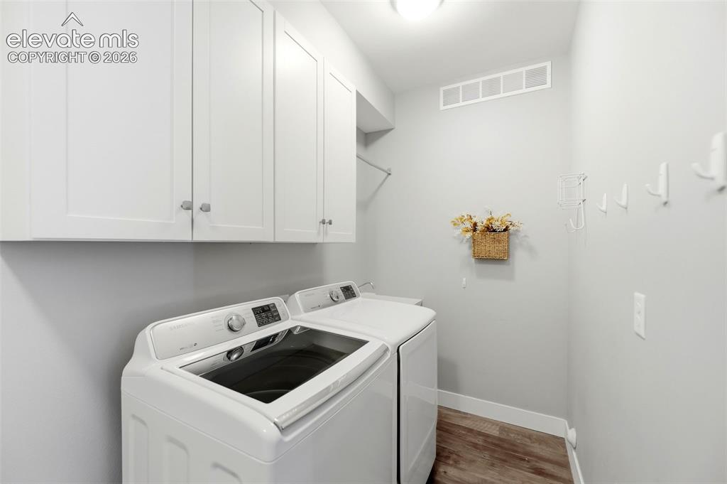 Image 20 of 42: Laundry Room with Cabinets
