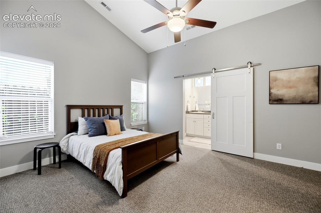 Image 25 of 42: Primary Bedroom with High Angled Ceiling