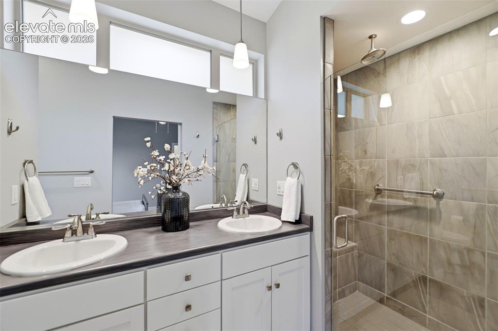 Image 27 of 42: Primary Bath with Dual Sinks and Walk in Shower